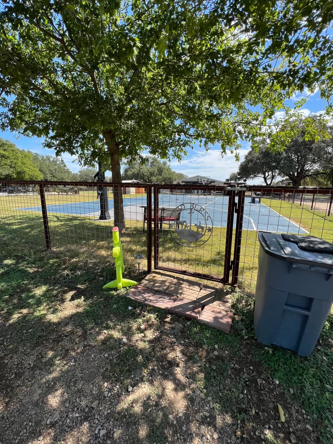 Custom welded steel fence with matching driveway gate